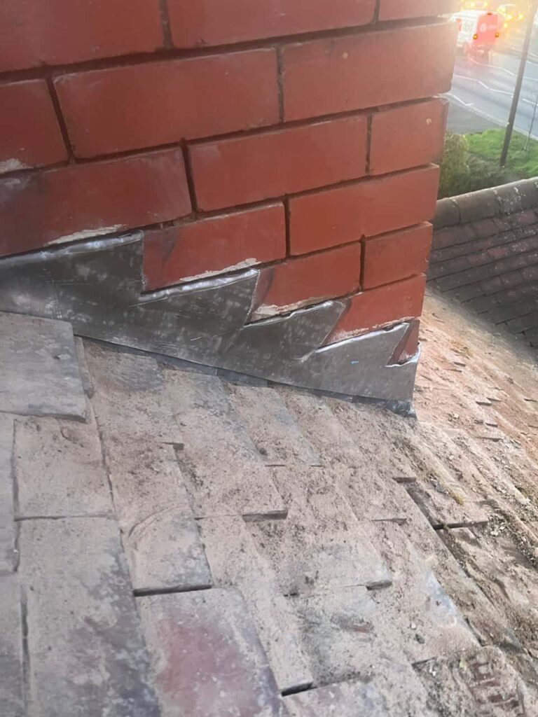 This is a photo of new leadwork being installed around an old chimney. Works carried out by TRP Roofing Hedon